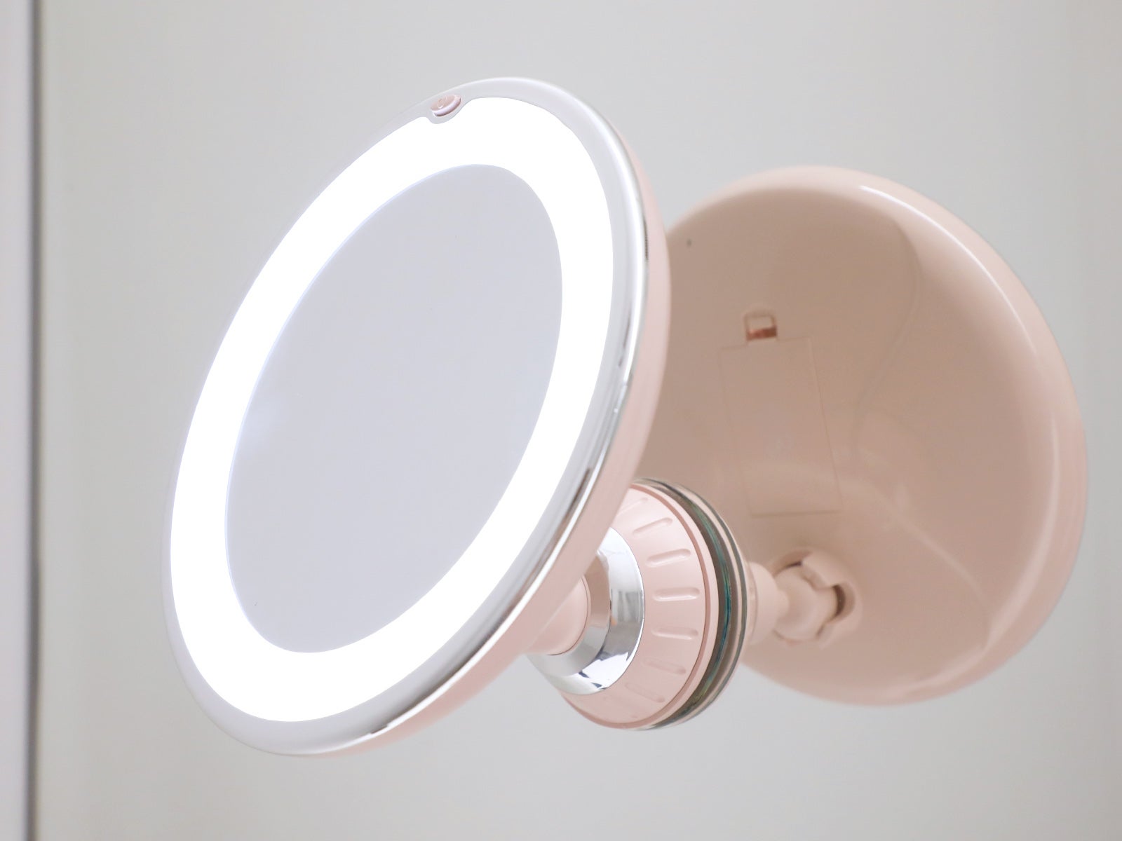 Espejo con luz y aumento x10 rosa