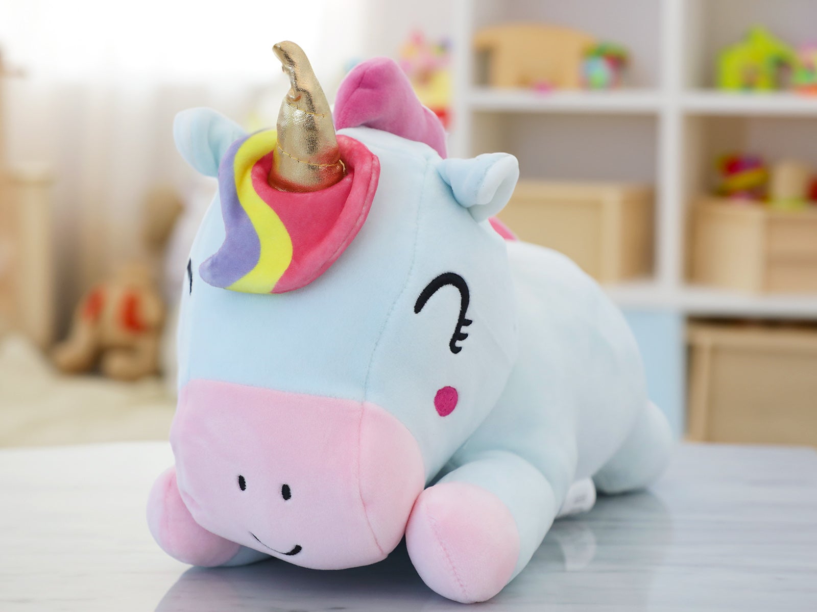 Lying unicorn plush