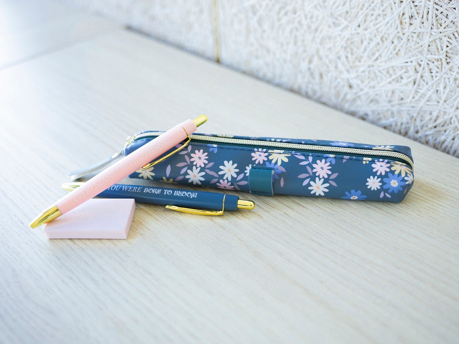 Set of pencil case, eraser and two green pens
